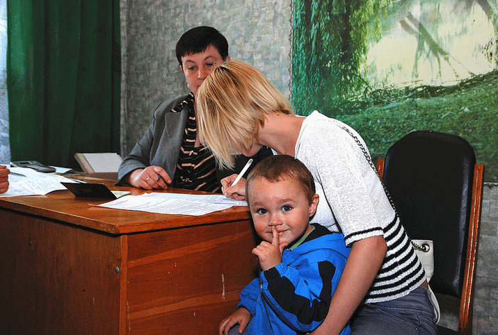 Woman Signing Papers Home Loan