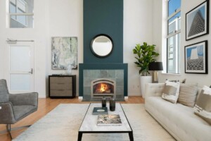 Interior living room with tall feature-wall fireplace for Case Study blog on the Best San Francisco Realtor Helping a Home Buyer