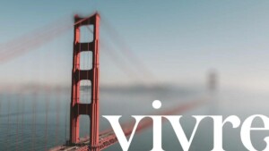 Vivre Real Estate logo over blurry image of San Francisco Golden Gate Bridge