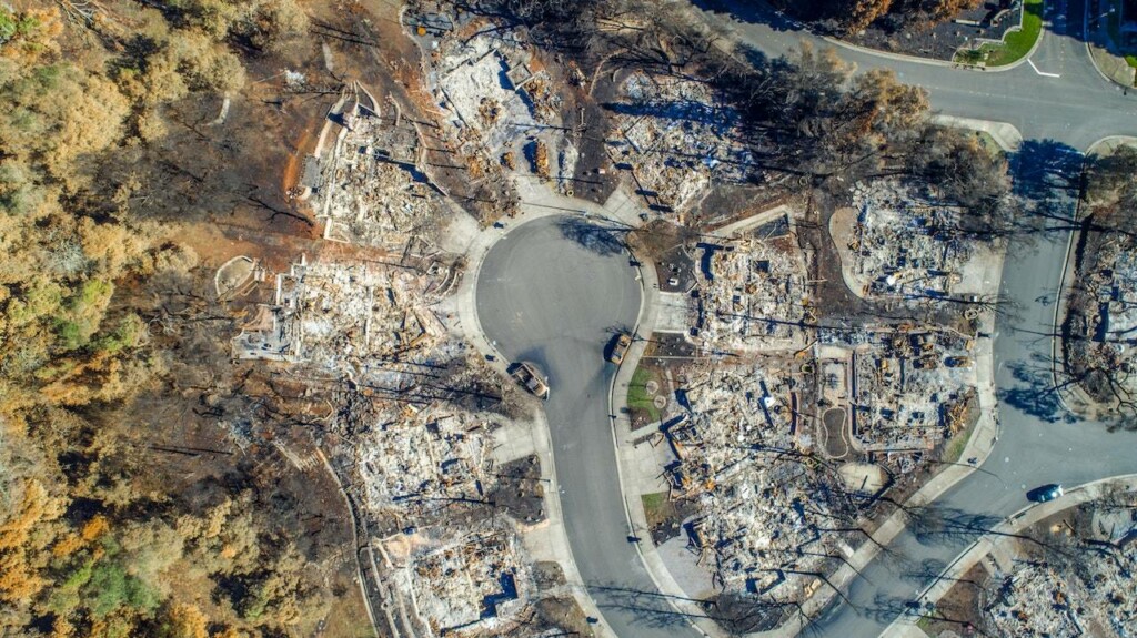 Drone image of burned homes and wildfire damage which has promted changes in home insurance San Francisco