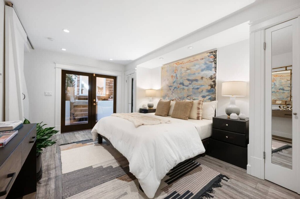 A serene retreat: the large, stylish bedroom in the Soma home, with direct backyard access.