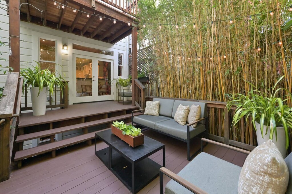 Tranquil and secluded backyard deck and patio area of the Soma condo.