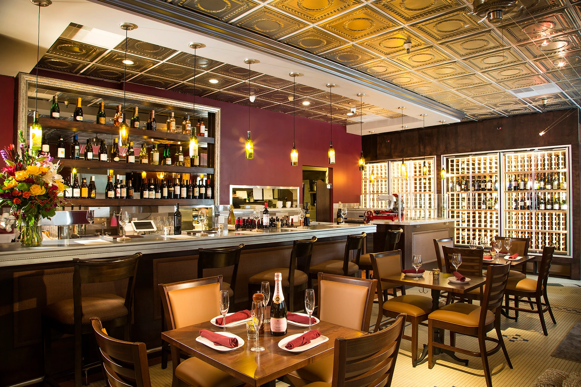 Interior View of Upscale Wine Bar with Tables and Bar Seating with Large Wine Selection at Scopo Divino