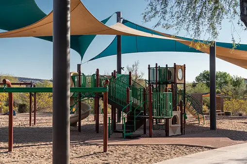 Playground with Slides, Jungle Gym, And Swings