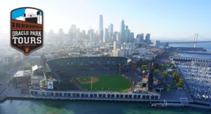 Aerial Picture of Oracle Park Stadium, Downtown San Francisco Highrises and Skyline, and the Bay with Oracle Park Tours Badge