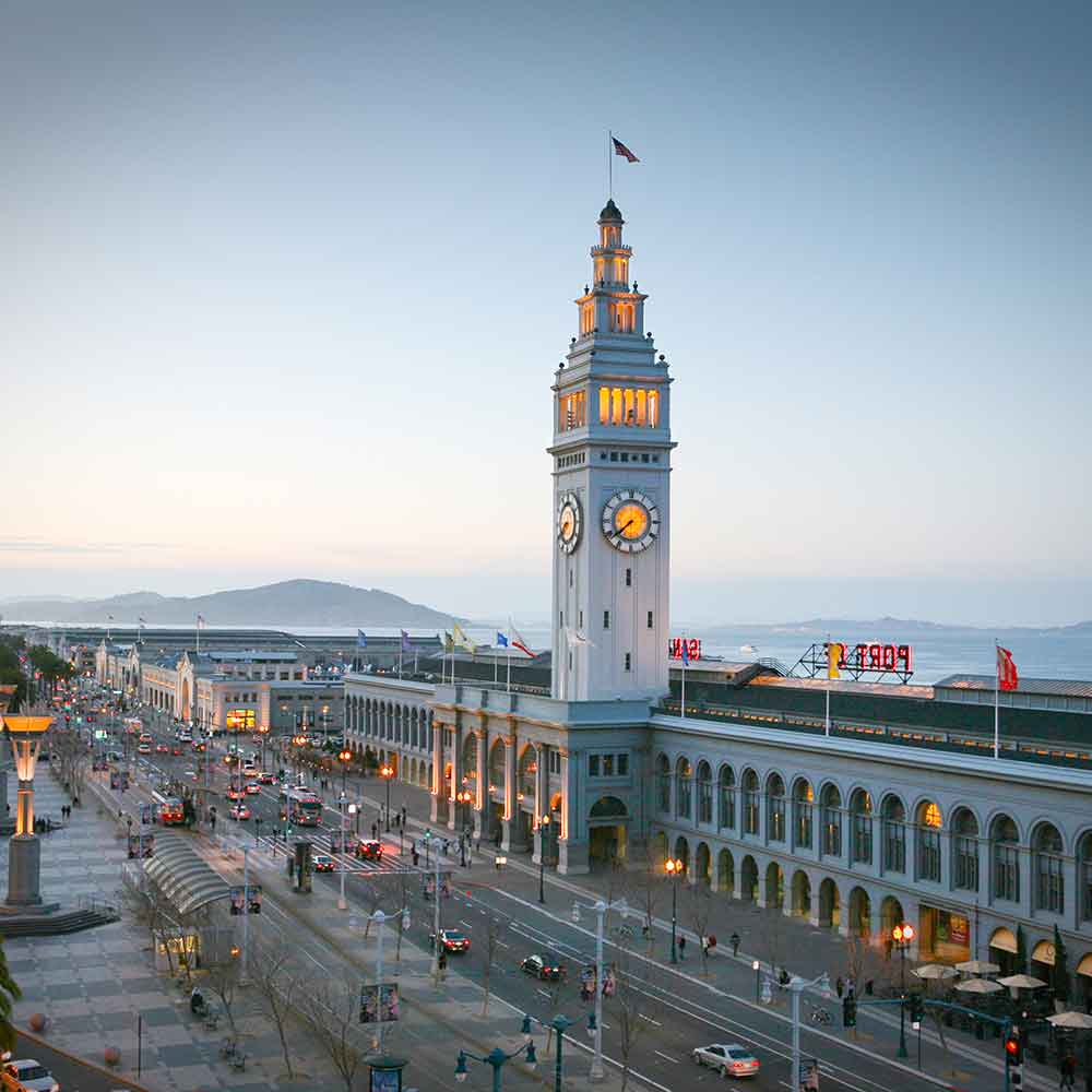 Street Aerial View of the Ferry Building Marketplace and Its Iconic Clock Tower at Dusk