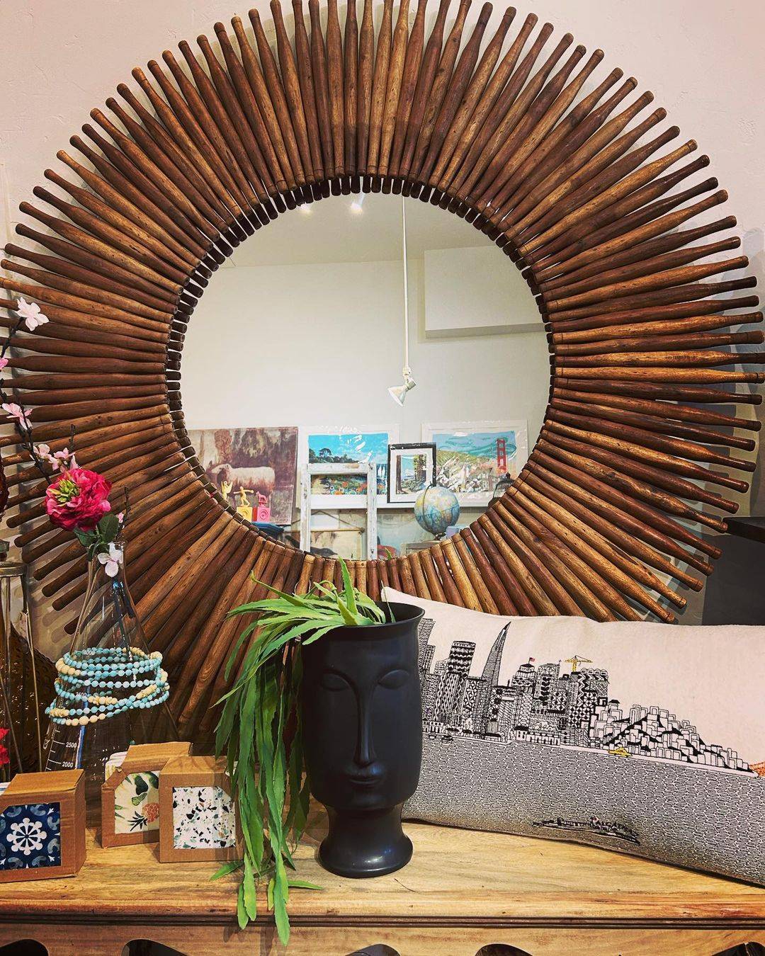 Unique antique housewares for sale at When Modern Was in SF including large round mirror, face vase, SF skyline throw pillow, and jewelry