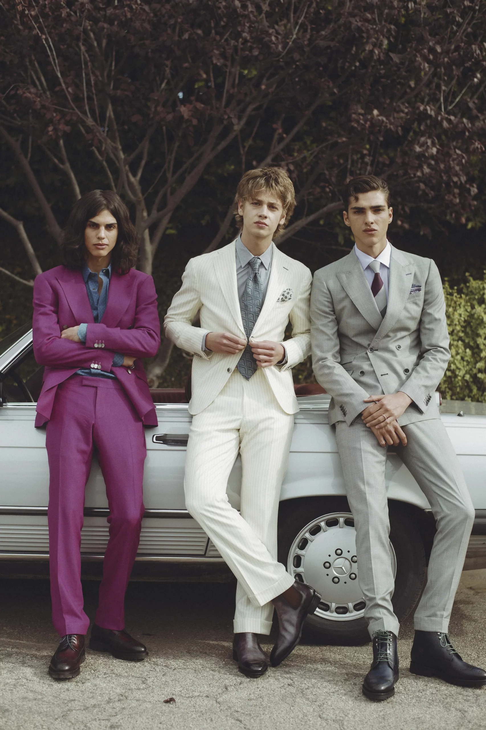 Three Male Models in Custom Bespoke Magenta, White Striped, and Gray Suits from Klein Epstein Parker and Leaning Against a Vintage Mercedes Convertible