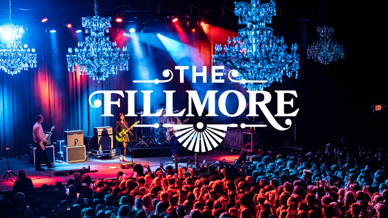 View of packed venue full of concertgoers while a band is playing live at the Fillmore in San Francisco