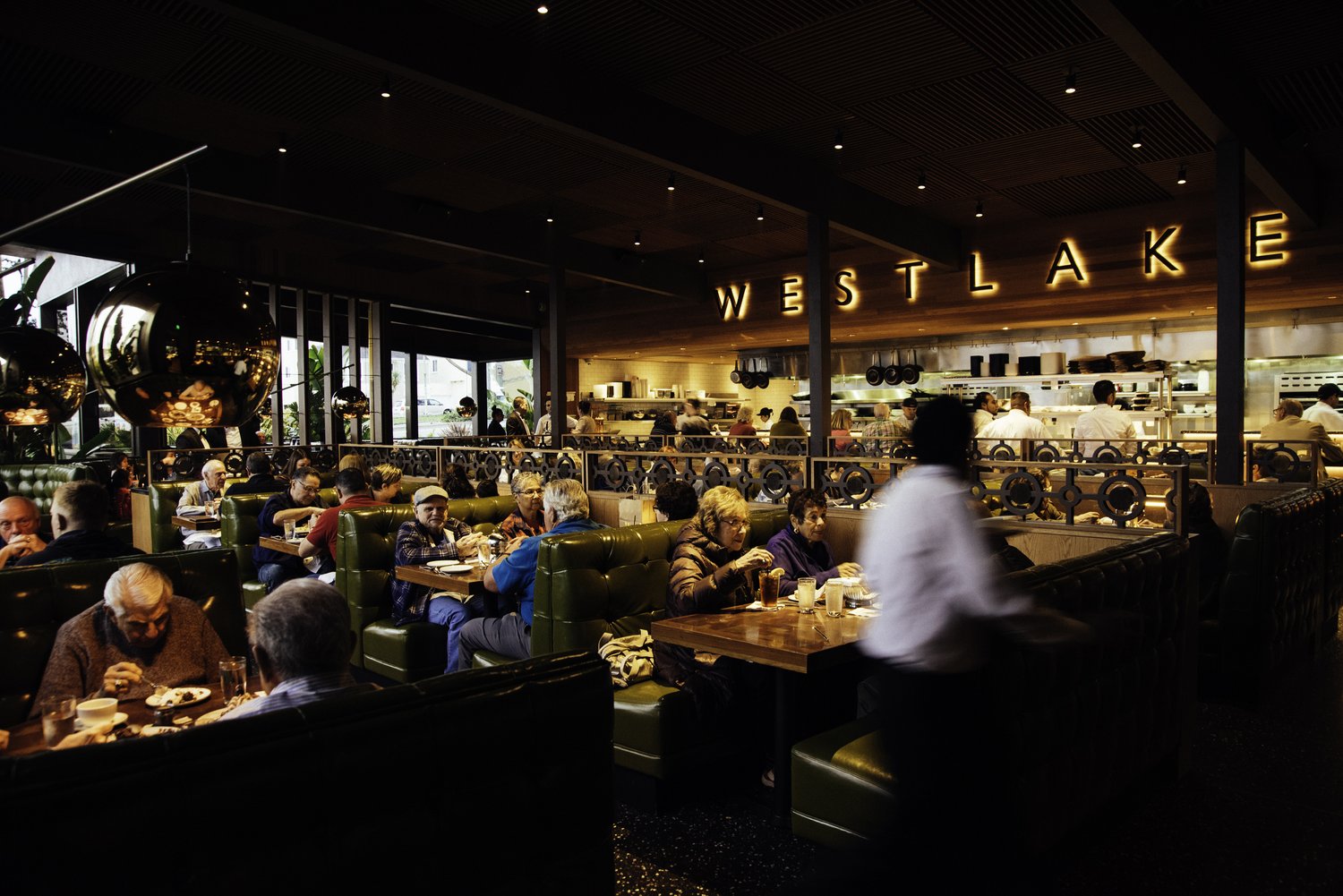 Interior of Original Joe’s Westlake dining room, packed with diners