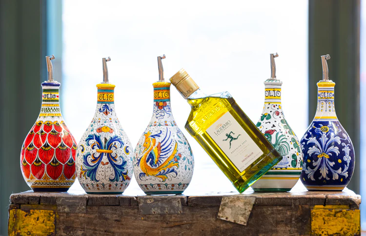 Artisan Italian Olive Oil Bottle Surrounded by hand painted oil and vinegar bottles