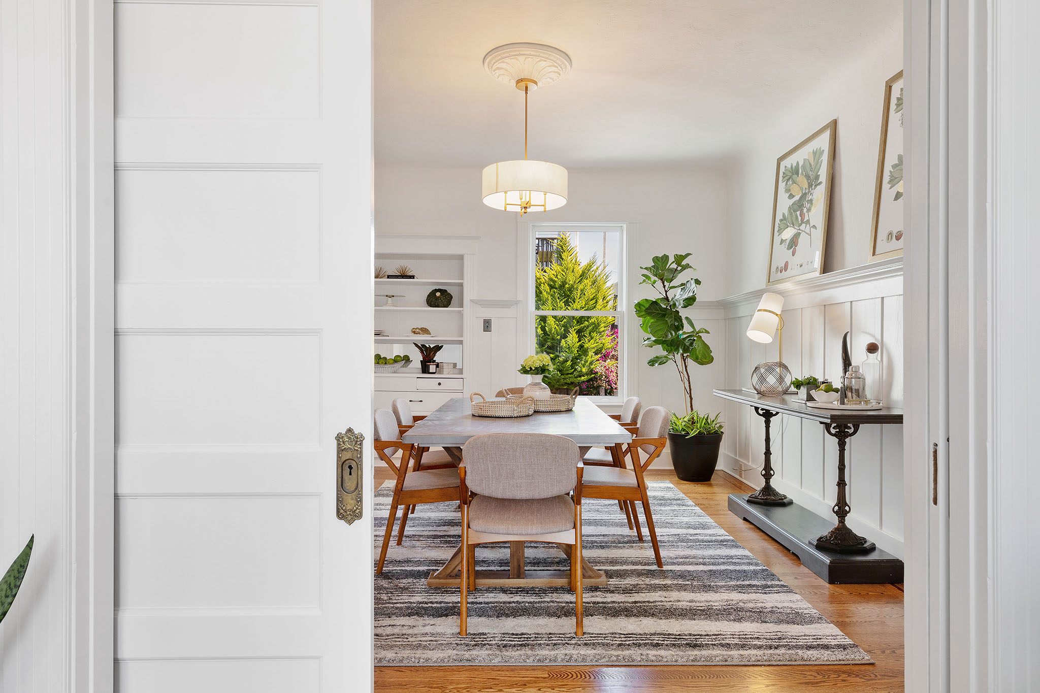 pocket door opening to a dining room at a real estate listing for top SF realtor Danielle Lazier, on the topic of should you accept a pre-emptive offer on your home for sale in San Francisco